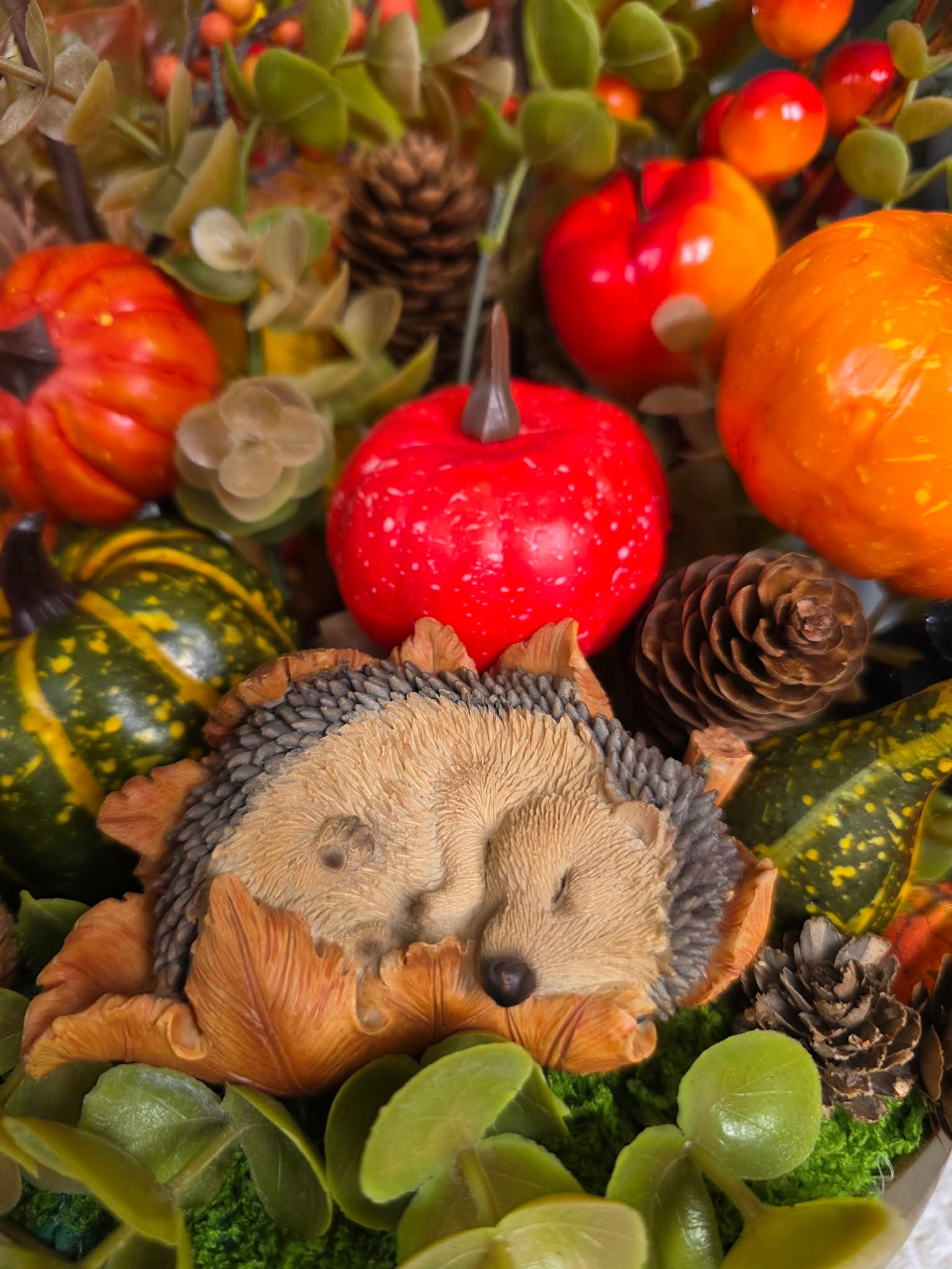 Fall Centerpiece with Sleeping Hedgehog, Colorful Pumpkins, and Pinecones