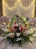 Lighted Santa and Mrs. Claus Holiday Arrangement with Evergreen Arch, Red Berries, and Pine