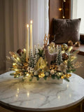 Elegant Christmas Arrangement in White Planter: Flocked Deer, Snowy Pine Trees, and Twin Taper Candles